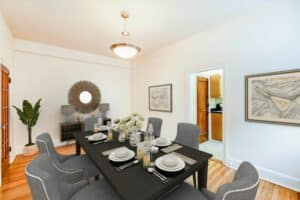 dining area with table, chairs, hardwood floors, french doors and view of kitchen at 2800 ontario road apartments in adams morgan washington dc