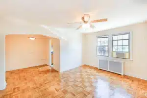 living area with hardwood floors, ceiling fan, dining area and view of kitchen at meridian park apartments in washington dc