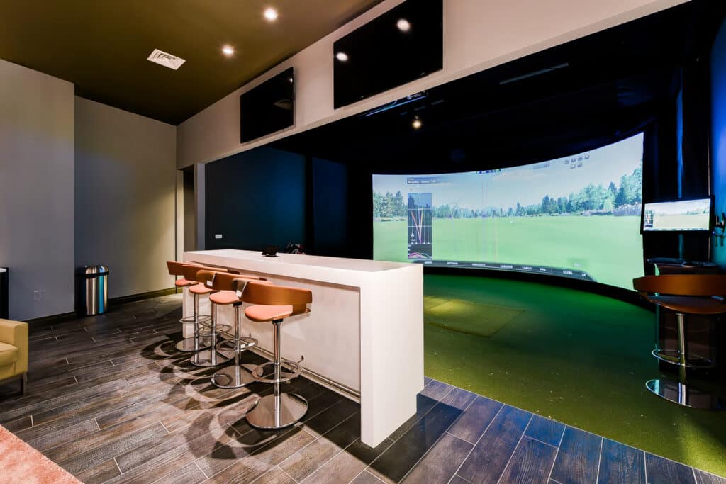 golf simulator room at agora apartments in washington dc