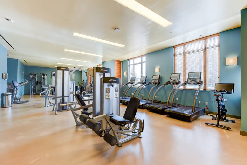 fitness center with cardio and strength training machines at park chelsea apartments in washington dc