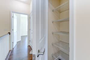 hallway view of bedrooms and linen closet at sheridan station south townhome apartments in washington dc