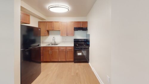 kitchen with new appliances and wood flooring at ridgecrest village apartments in washington dc